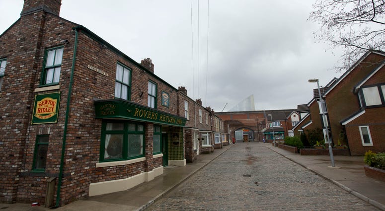 FILE - In this file photo dated Friday, Nov. 29, 2013, the film set of long running British soap opera entitled 'Coronation Street', in Manchester, England. The long running TV series covering an intimate look into the lives of families in the fictional n FILE - In this file photo dated Friday, Nov. 29, 2013, the film set of long running British soap opera entitled 'Coronation Street', in Manchester, England. The long running TV series covering an intimate look into the lives of families in the fictional n