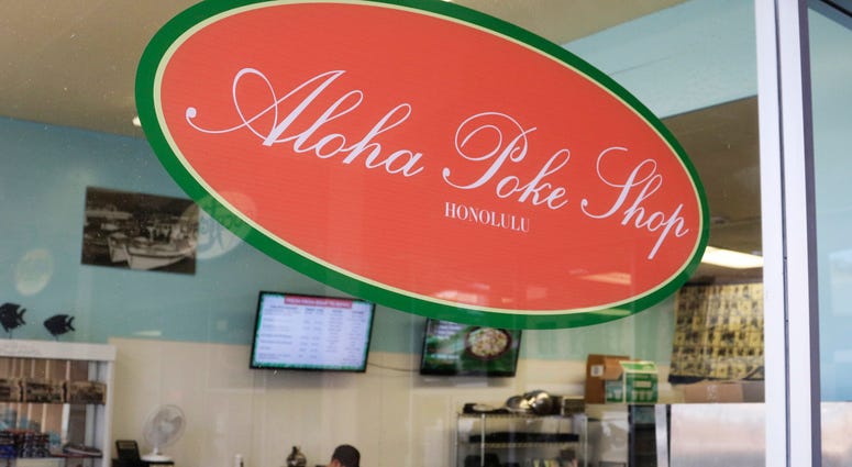 This Tuesday, April 16, 2019, photo shows Aloha Poke Shop, a store in Honolulu that received a letter from Chicago-based Aloha Poke Co. saying the Illinois company had trademarked "Aloha Poke" and the Hawaii company would need to change its name Hawaii lawmakers are considering adopting a resolution calling for the creation of legal protections for Native Hawaiian cultural intellectual property.