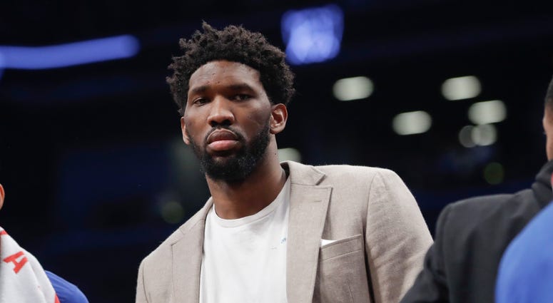Philadelphia 76ers' Joel Embiid watches during the first half in Game 3 of the team's first-round NBA basketball playoff series against the Brooklyn Nets on Thursday, April 18, 2019, in New York. Philadelphia 76ers' Joel Embiid watches during the first half in Game 3 of the team's first-round NBA basketball playoff series against the Brooklyn Nets on Thursday, April 18, 2019, in New York.