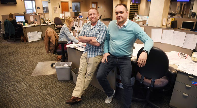 In this April 9, 2019, photo, Argus Leader investigative reporter Jonathan Ellis and news director Cory Myers in the newsroom in Sioux Falls, S.D. In 2010, reporters at South Dakota’s Argus Leader newspaper came up with the idea of requesting data about In this April 9, 2019, photo, Argus Leader investigative reporter Jonathan Ellis and news director Cory Myers in the newsroom in Sioux Falls, S.D. In 2010, reporters at South Dakota’s Argus Leader newspaper came up with the idea of requesting data about