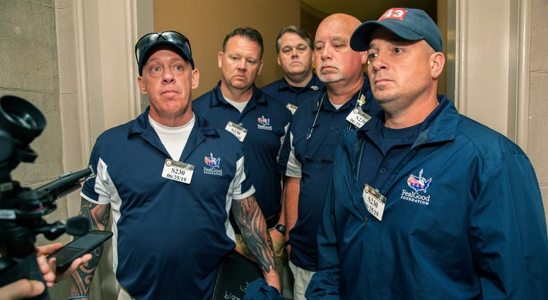Sept. 11 first responders John Feal, left, Ret. Lt. Michael O'Connell, right, and other first responders speak to reporters as they leave the office of Senate Majority Leader Mitch McConnell, following their meeting at McConnell's office on Capitol Hill. Sept. 11 first responders John Feal, left, Ret. Lt. Michael O'Connell, right, and other first responders speak to reporters as they leave the office of Senate Majority Leader Mitch McConnell, following their meeting at McConnell's office on Capitol Hill.