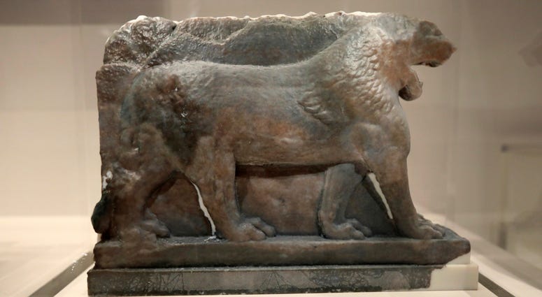 A 3D printed recreation of the ancient Lion of Mosul, which was destroyed by the Islamic State group at the Mosul Museum in Iraq, is displayed as part of the 'What Remains' exhibition at the Imperial War Museum in London, Wednesday, July 3, 2019. A 3D printed recreation of the ancient Lion of Mosul, which was destroyed by the Islamic State group at the Mosul Museum in Iraq, is displayed as part of the 'What Remains' exhibition at the Imperial War Museum in London, Wednesday, July 3, 2019.