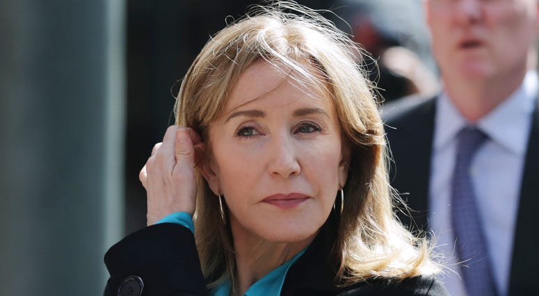 FILE - In this April 3, 2019 file photo, actress Felicity Huffman arrives at federal court in Boston to face charges in a nationwide college admissions bribery scandal. FILE - In this April 3, 2019 file photo, actress Felicity Huffman arrives at federal court in Boston to face charges in a nationwide college admissions bribery scandal.