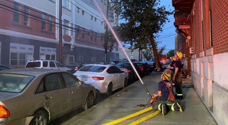 Philly firefighters still on scene hosing down hotspots at a vacant, 4-story apartment building at 1600 West Oxford Street in North Philadelphia. Philly firefighters still on scene hosing down hotspots at a vacant, 4-story apartment building at 1600 West Oxford Street in North Philadelphia.