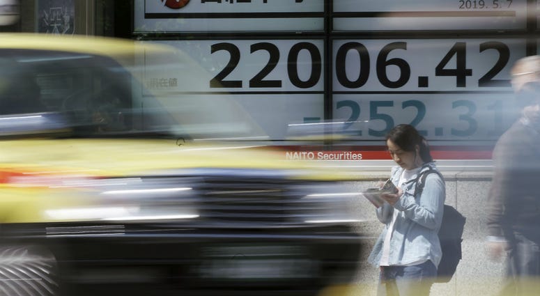 An electronic stock board shows Japan's Nikkei 225 index at a securities firm in Tokyo Tuesday, May 7, 2019. An electronic stock board shows Japan's Nikkei 225 index at a securities firm in Tokyo Tuesday, May 7, 2019.