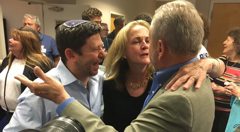 Madeleine Dean is flocked by supporters who feel a victory at the end of a three- person race for the newly drawn 4th District. Madeleine Dean is flocked by supporters who feel a victory at the end of a three- person race for the newly drawn 4th District.