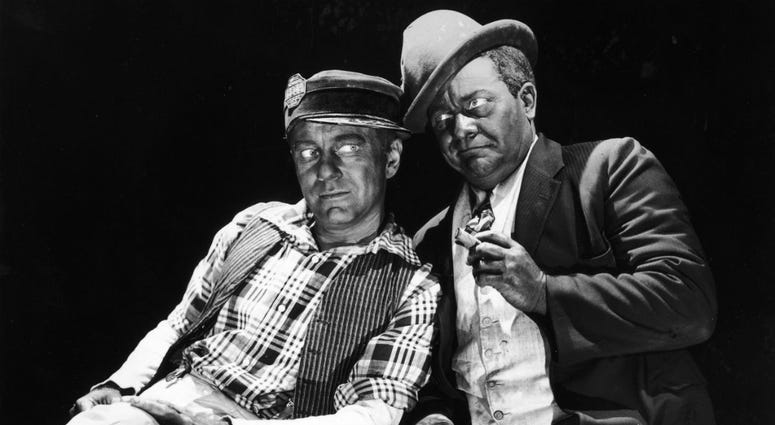 American actors and comedy partners Charles Correll (L) and Freeman Gosden lean against each other in blackface makeup in a 1949 promotional portrait. blackface