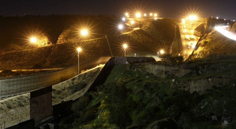Floodlights from the U.S, illuminate multiple border walls Monday, Jan. 7, 2019, seen from Tijuana, Mexico. Floodlights from the U.S, illuminate multiple border walls Monday, Jan. 7, 2019, seen from Tijuana, Mexico.
