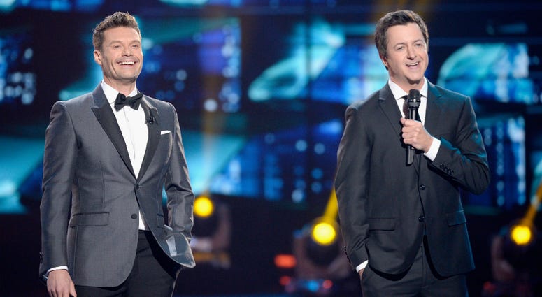 Brian Dunkleman, the former co-host of the first season of "American Idol", is hitting back after TMZ unearthed his current occupation. From left: Ryan Seacrest and Brian Dunkleman