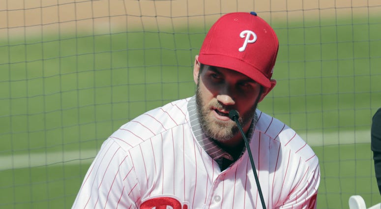 In this Saturday, March 2, 2019 file photo, Bryce Harper speaks during a news conference at the Philadelphia Phillies spring training baseball facility in Clearwater, Fla. In this Saturday, March 2, 2019 file photo, Bryce Harper speaks during a news conference at the Philadelphia Phillies spring training baseball facility in Clearwater, Fla.