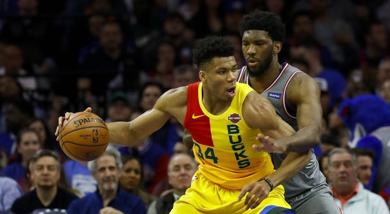 Milwaukee Bucks' Giannis Antetokounmpo, left, tries to drive past Philadelphia 76ers' Joel Embiid during the first half of an NBA basketball game, Thursday, April 4, 2019, in Philadelphia. Milwaukee Bucks' Giannis Antetokounmpo, left, tries to drive past Philadelphia 76ers' Joel Embiid during the first half of an NBA basketball game, Thursday, April 4, 2019, in Philadelphia.