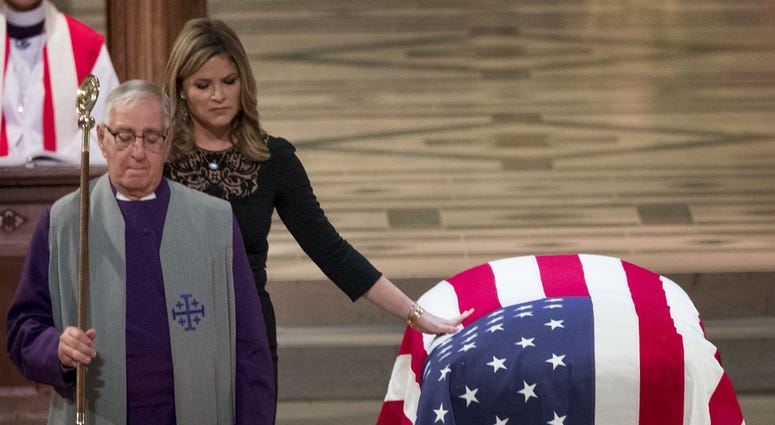Jenna Bush Hager, the daughter of former President George Bush, touches the casket of former President George H.W. Bush after speaking at his State Funeral at the National Cathedral, December 5, 2018 in Washington, DC. Jenna Bush Hager, the daughter of former President George Bush, touches the casket of former President George H.W. Bush after speaking at his State Funeral at the National Cathedral, December 5, 2018 in Washington, DC.