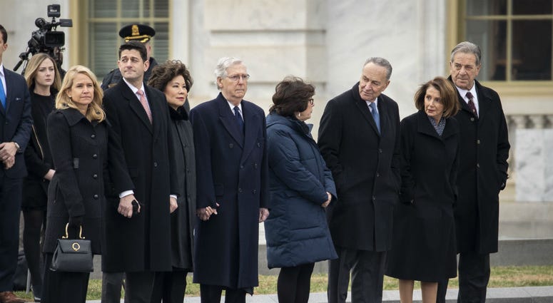 Janna Ryan, Paul Ryan, Elaine Chao, Mitch McConnell, Iris Weinshall, Chuck Schumer, Nancy Pelosi and Paul Pelosi await the departure of the flag-draped casket of the late former President George H.W. Bush at the U.S. Capitol, December 5, 2018. Janna Ryan, Paul Ryan, Elaine Chao, Mitch McConnell, Iris Weinshall, Chuck Schumer, Nancy Pelosi and Paul Pelosi await the departure of the flag-draped casket of the late former President George H.W. Bush at the U.S. Capitol, December 5, 2018.