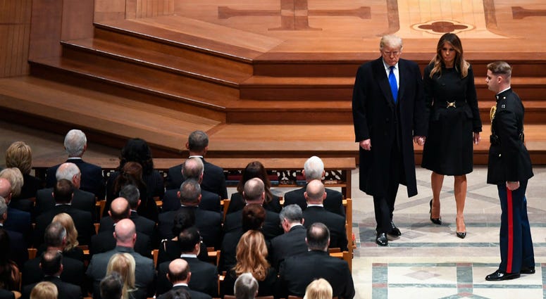 President Donald Trump and first lady Melanie Trump arrive as former President George H.W. Bush is honored with a state funeral at the Washington National Cathedral. President Donald Trump and first lady Melanie Trump arrive as former President George H.W. Bush is honored with a state funeral at the Washington National Cathedral.
