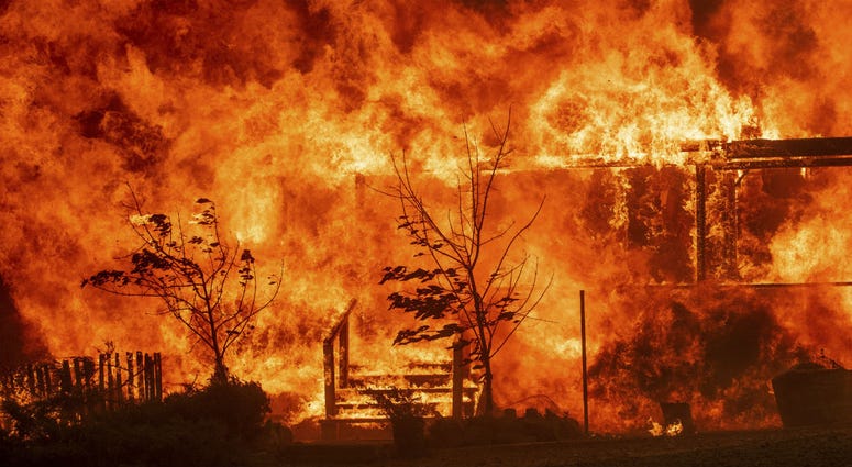 Flames consume a home as the River Fire tears though Lakeport, Calif., on Tuesday, July 31, 2018. Flames consume a home as the River Fire tears though Lakeport, Calif., on Tuesday, July 31, 2018.