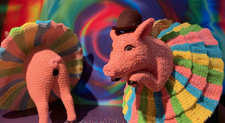 A candy sculpture of ballerina pigs. A candy sculpture of ballerina pigs.