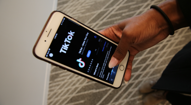 Social media app TikTok on a phone. Social media app TikTok on a phone.