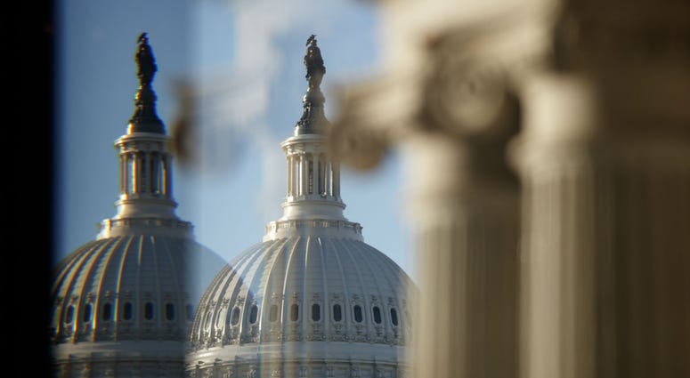 The U.S. Capitol Building Dome is seen through a beveled window at the Library of Congress in Washington, Wednesday, Dec. 19, 2018. The U.S. Capitol Building Dome is seen through a beveled window at the Library of Congress in Washington, Wednesday, Dec. 19, 2018.
