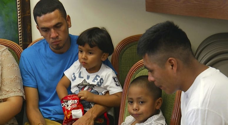 In this image taken from video, Javier Garrido Martinez, left and Alan Garcia, right, sit with their 4-year-sons at a news conference in New York, Wednesday, July 11, 2018. In this image taken from video, Javier Garrido Martinez, left and Alan Garcia, right, sit with their 4-year-sons at a news conference in New York, Wednesday, July 11, 2018.