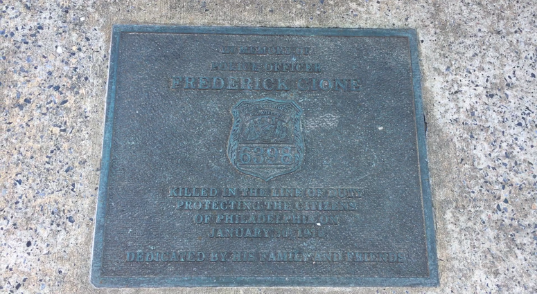 The memorial plaque at the spot where Fred Cione was shot and killed on Oxford Street, in North Philadelphia. Fred Cione memorial