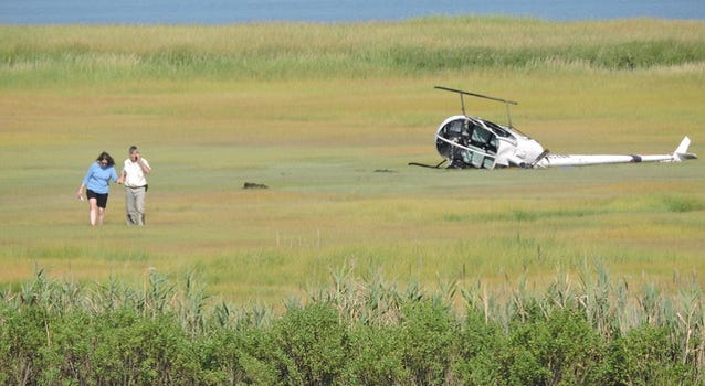 A crashed helicopter lies in the marsh grass near the Ocean City airport at 28th Street. A crashed helicopter lies in the marsh grass near the Ocean City airport at 28th Street.