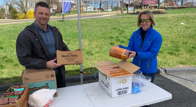 Dr. Natalie Parisi (right) and Dr. Dennis Mauro (left) examine the donated medical gloves collected outside the Reading Orthodontics Group office in Pottstown. Parisi spearheaded the collection drive to help health care workers amid the coronavirus. Reading Orthodontics Group collection drive