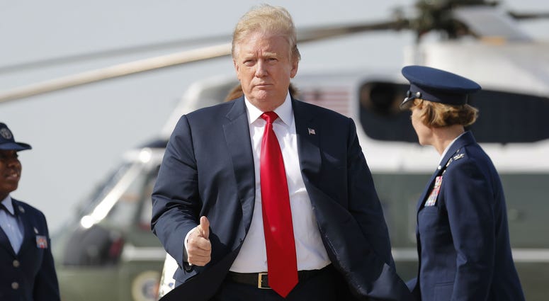 President Donald Trump gives a 'thumbs-up' as he prepares to board Air Force One, Thursday, April 18, 2019, at Andrews Air Force Base, Md. President Donald Trump gives a 'thumbs-up' as he prepares to board Air Force One, Thursday, April 18, 2019, at Andrews Air Force Base, Md.