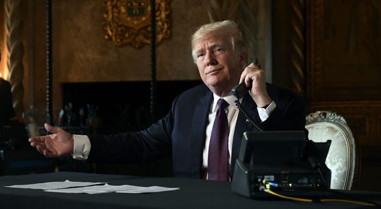 President Donald Trump asks if reporters can hear the audio as he talks with troops via teleconference from his Mar-a-Lago estate in Palm Beach, Fla., Thursday, Nov. 22, 2018. President Donald Trump asks if reporters can hear the audio as he talks with troops via teleconference from his Mar-a-Lago estate in Palm Beach, Fla., Thursday, Nov. 22, 2018.
