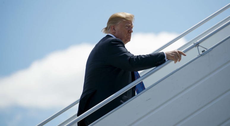 President Donald Trump boards Air Force One for a trip to Singapore to meet with North Korean leader Kim Jong Un, Saturday, June 9, 2018, at Canadian Forces Base Bagotville, in Canada. President Donald Trump boards Air Force One for a trip to Singapore to meet with North Korean leader Kim Jong Un, Saturday, June 9, 2018, at Canadian Forces Base Bagotville, in Canada.