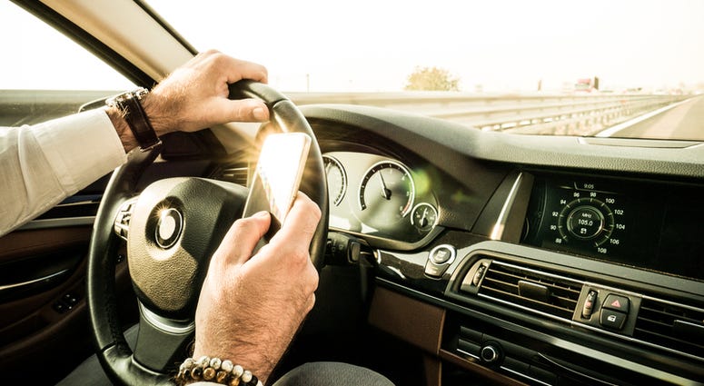Texting while driving. Texting while driving.