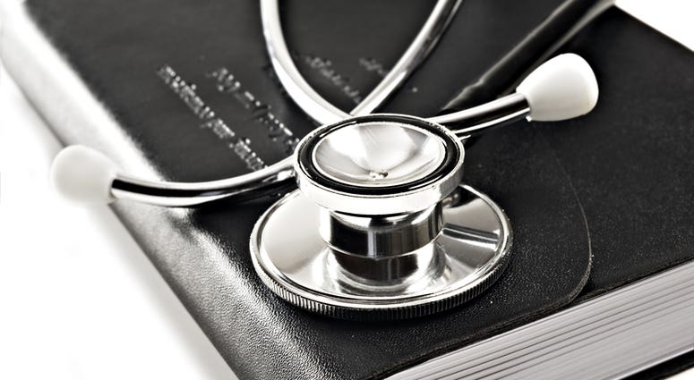 Close up macro of a black diary and a medical stethoscope. Medical Journal