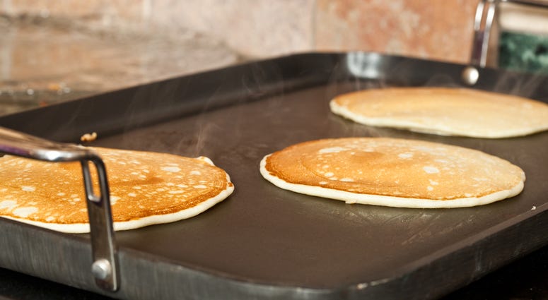 Making pancakes on an oven griddle pancakes