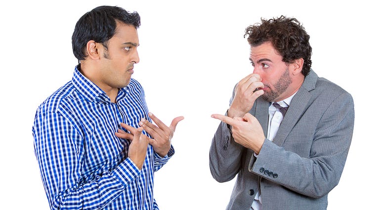 Closeup portrait, men looking at guy closing, covering nose, something stinks, very bad smell, odor. Body Odor