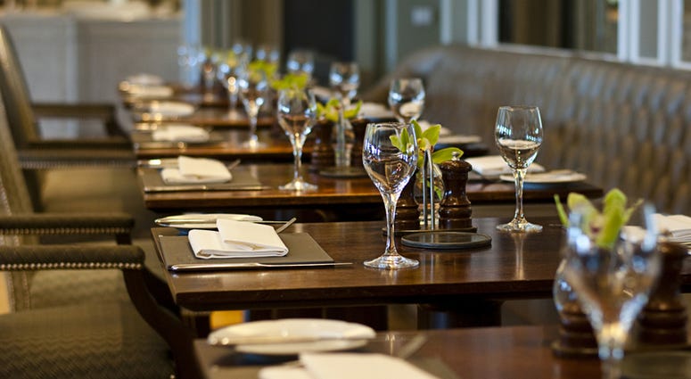 Cozy restaurant and tables ready for dinner. Restaurant Week