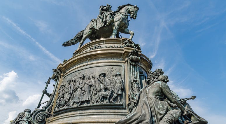 The bronze and granite statue of George Washington on horse in Philadelphia, Pennsylvania, along the Benjamin Franklin Parkway. The bronze and granite statue of George Washington on horse in Philadelphia, Pennsylvania, along the Benjamin Franklin Parkway.