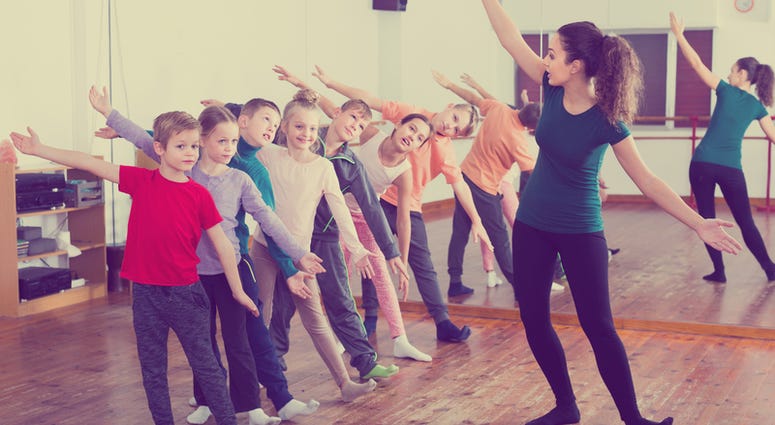 Boys and girls studying contemp dance in dancing studio Boys and girls studying contemp dance in dancing studio