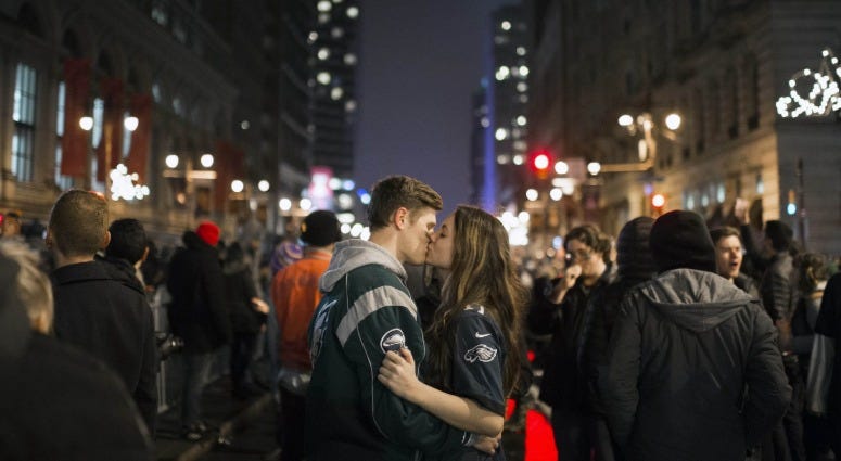 Julia Kauterman, right, and Michael Banes of Berlin, N.J. kiss on Broad Street as Philadelphia Eagles fans celebrate a Super Bowl win against the New England Patriots, Feb. 5, 2018. Eagles fans
