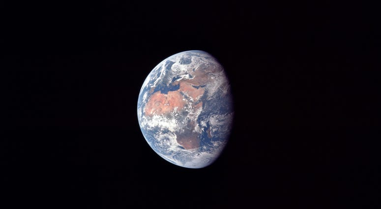 Earth at about 182,500 km or 98,500 nautical miles. North is up and the African continent is prominent. Also visible are Arabia, Asia and Europe, particularly Spain. Earth at about 182,500 km or 98,500 nautical miles. North is up and the African continent is prominent. Also visible are Arabia, Asia and Europe, particularly Spain.