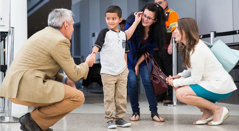 In this July 14, 2018, file photo, Jelsin Aguilar Padilla shakes immigration attorney Jorge L. Baron's hand after stepping off his flight from New York into the Seattle-Tacoma International Airport as he is reunited with his mother Yolany in Seattle. In this July 14, 2018, file photo, Jelsin Aguilar Padilla shakes immigration attorney Jorge L. Baron's hand after stepping off his flight from New York into the Seattle-Tacoma International Airport as he is reunited with his mother Yolany in Seattle.