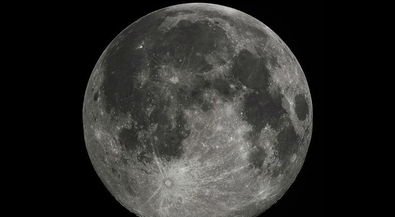 Full Moon in the darkness of the night sky. Full Moon in the darkness of the night sky.