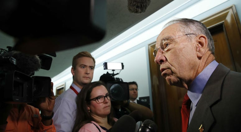 Sen. Chuck Grassley, R-Iowa, right, chair of the Senate Judiciary Committee, answers questions from reporters about allegations of sexual misconduct against Supreme Court nominee Brett Kavanaugh, Wednesday, Sept. 26, 2018. Sen. Chuck Grassley, R-Iowa, right, chair of the Senate Judiciary Committee, answers questions from reporters about allegations of sexual misconduct against Supreme Court nominee Brett Kavanaugh, Wednesday, Sept. 26, 2018.