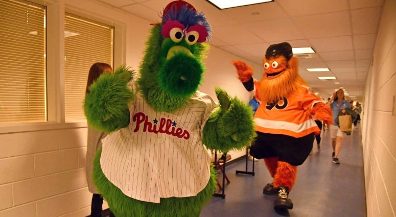 Phillie Phanatic leads Gritty through the hallway toward the field before he was introduced in between innings of game between Philadelphia Phillies and Atlanta Braves at Citizens Bank Park on Sept. 29, 2018. Phillie Phanatic and Gritty