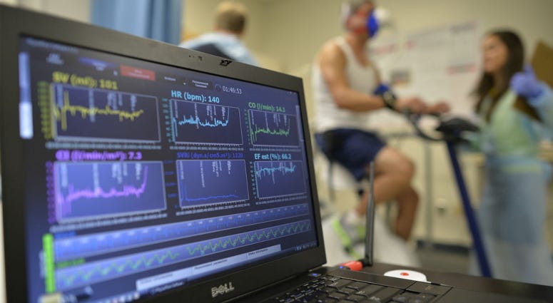 In this Aug. 27, 2014 file photo, a laptop computer monitors a patient's heart function as he takes a stress test while riding a stationary bike in Augusta, Ga. In this Aug. 27, 2014 file photo, a laptop computer monitors a patient's heart function as he takes a stress test while riding a stationary bike in Augusta, Ga.