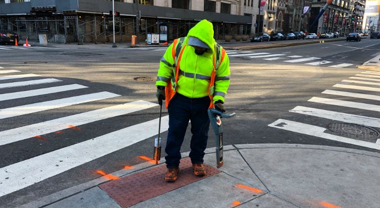 Errol Ray outside spraying paint in Center City on a frigid Monday afternoon. Errol Ray outside spraying paint in Center City on a frigid Monday afternoon.