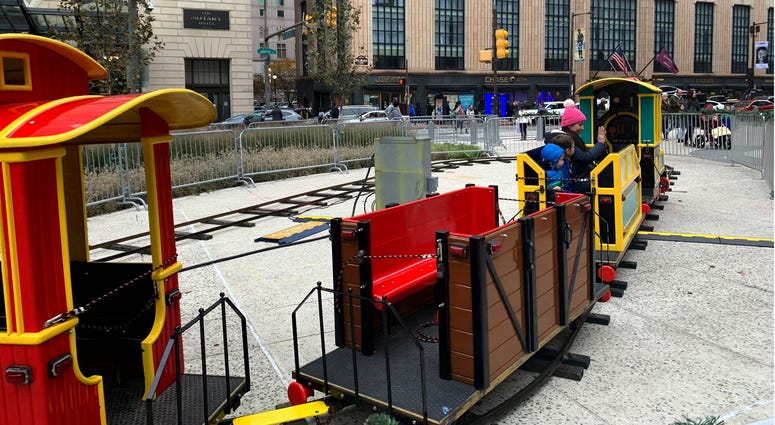 Holiday market visitors enjoying the new train. Holiday market visitors enjoying the new train.