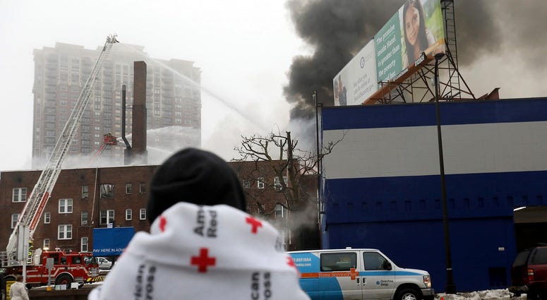 People displaced by the fire wait to hear news on their fate after a four-alarm fire at the Francis Drake Hotel apartments that broke out early Christmas morning. People displaced by the fire wait to hear news on their fate after a four-alarm fire at the Francis Drake Hotel apartments that broke out early Christmas morning.