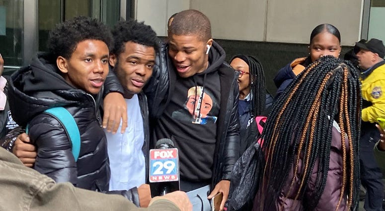 Fayaadh Gillard is greeted by friend sand family outside of the Criminal Justice Center. Fayaadh Gillard