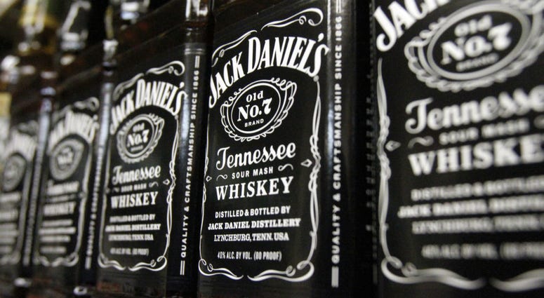In this Dec. 5, 2011, file photo, bottles of Jack Daniel's Tennessee Whiskey line the shelves of a liquor outlet in Montpelier, Vt. In this Dec. 5, 2011, file photo, bottles of Jack Daniel's Tennessee Whiskey line the shelves of a liquor outlet in Montpelier, Vt.