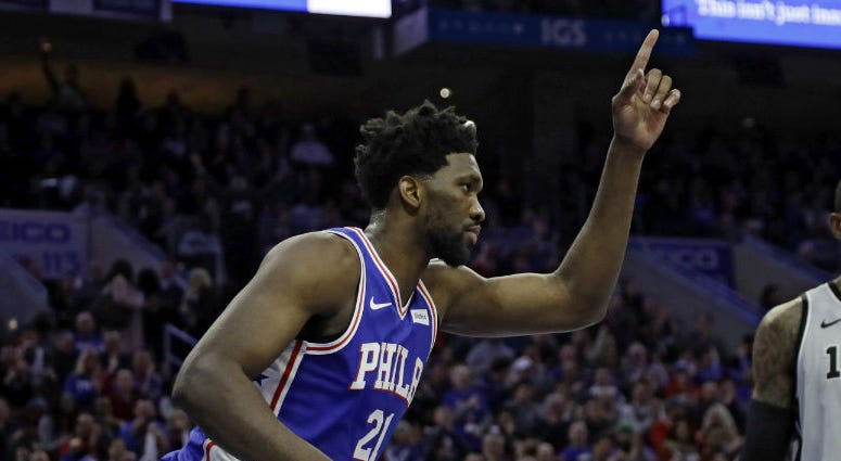 Philadelphia 76ers' Joel Embiid, left, celebrates after a dunk past San Antonio Spurs' LaMarcus Aldridge during the first half of an NBA basketball game, Wednesday, Jan. 23, 2019, in Philadelphia. Philadelphia 76ers' Joel Embiid, left, celebrates after a dunk past San Antonio Spurs' LaMarcus Aldridge during the first half of an NBA basketball game, Wednesday, Jan. 23, 2019, in Philadelphia.