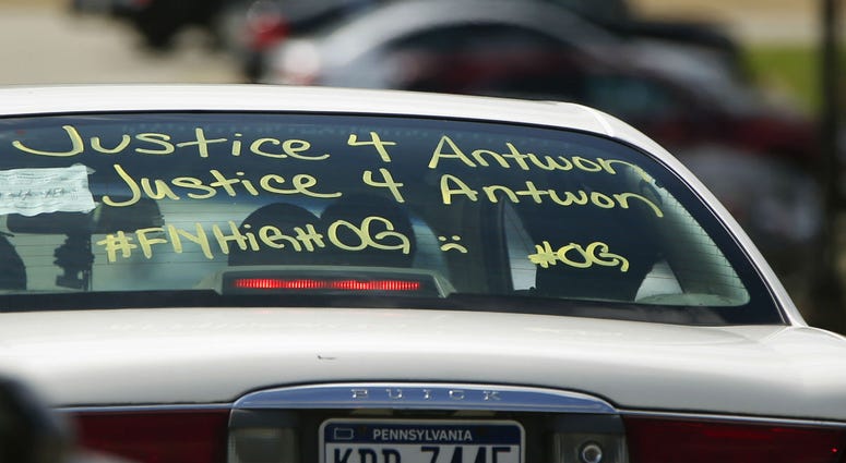 One of the vehicles in the funeral procession for Antwon Rose Jr. has a message displayed as it arrives at the Woodland Hills Intermediate school on Monday, June 25, 2018, in Swissvale, Pa. One of the vehicles in the funeral procession for Antwon Rose Jr. has a message displayed as it arrives at the Woodland Hills Intermediate school on Monday, June 25, 2018, in Swissvale, Pa.
